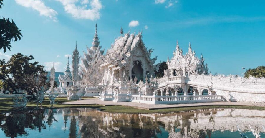 Chiang Mai: Chiang Rai Temples & Black House Discovery Tour - Wat Rong Suea Ten: Blue Temple Art and the Tiger-Linked Stories