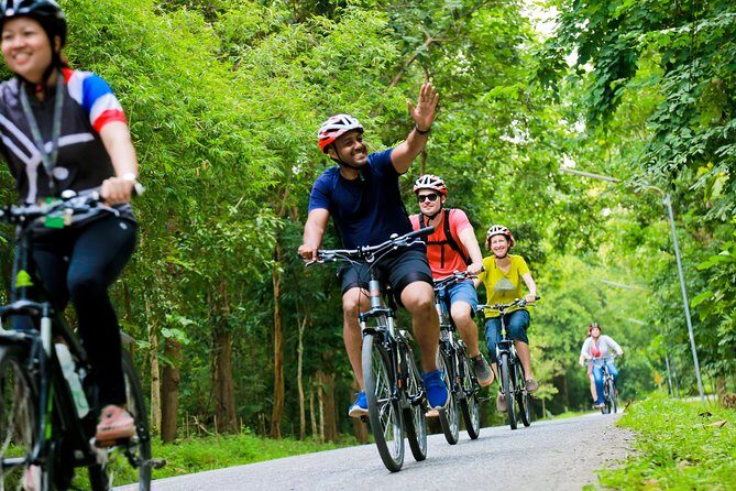 Chiang Mai Countryside Guided Bike Tour - Riding back toward Chiang Mai: orchards, canals, and the countryside shift