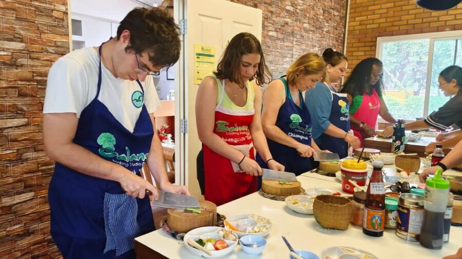 Chiang Mai: Morning Cooking Class with Market Visit - Galangal Cooking Studio: an air-conditioned kitchen with a lesson plan