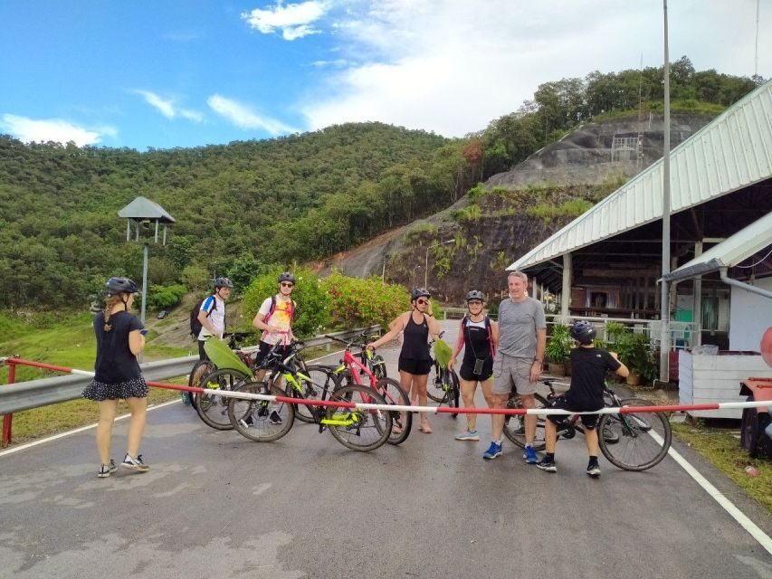 Chiang Mai: Rainforest Guided Mountain Biking Tour - Wat Doi Thaen Phra Pha Luang: photos, a swim, and the trail start
