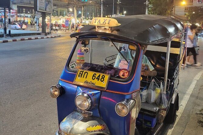 Chiang Mai Temples and Market Tuk-Tuk Evening Night Tour - Wat Phra Singh at night: Lion Buddha, active temple energy
